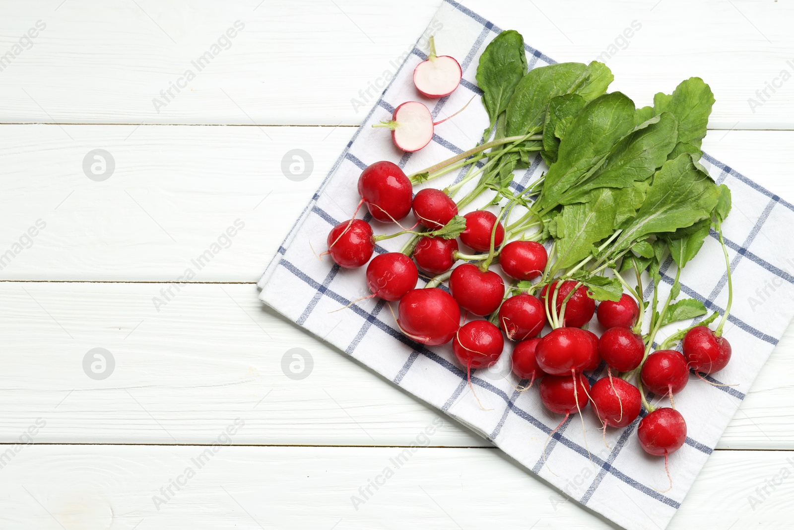 Many fresh radishes on white wooden table, top view. Space for text Photo of Many fresh radishes on white wooden table, top view. Space for text