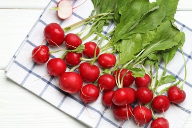 Photo of Many fresh radishes on white wooden table, top view