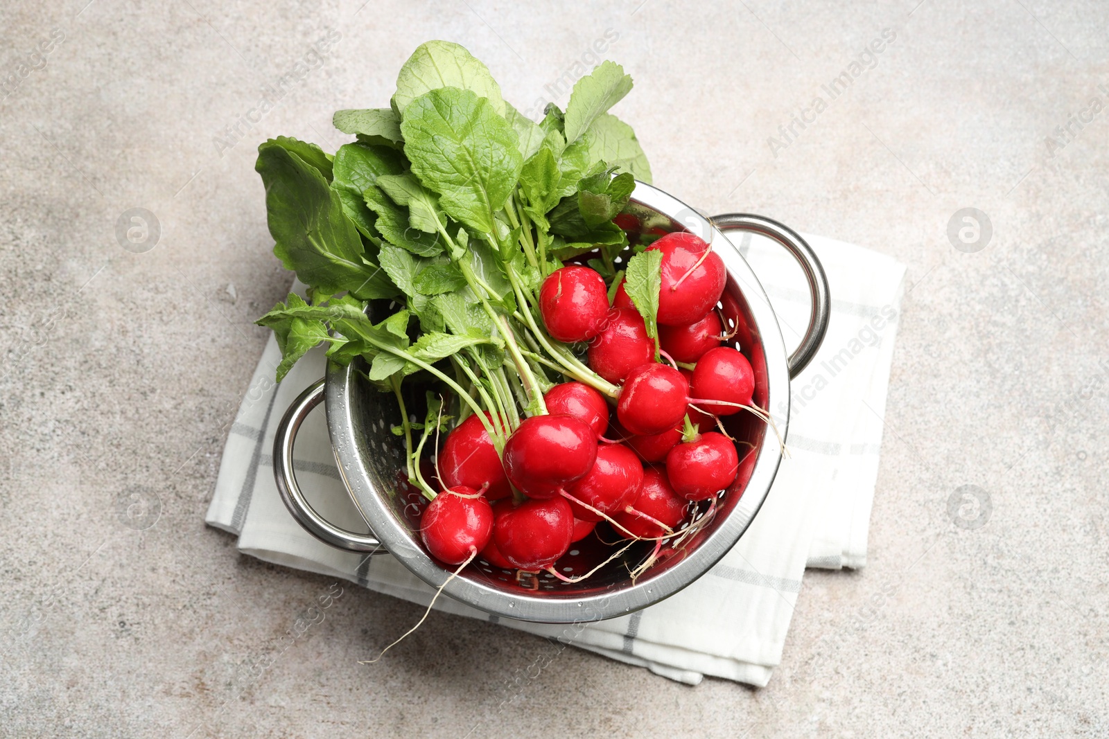 Many fresh radishes on grey textured table, top view Photo of Many fresh radishes on grey textured table, top view