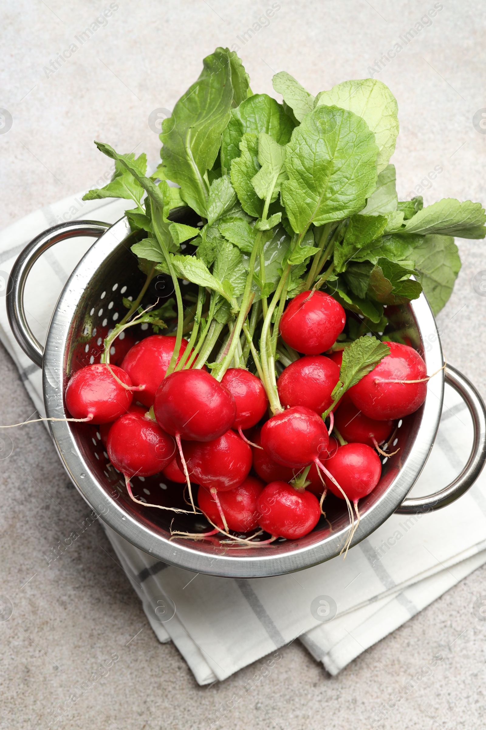 Many fresh radishes on grey textured table, top view Photo of Many fresh radishes on grey textured table, top view
