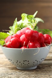 Photo of Many fresh radishes on wooden table, closeup