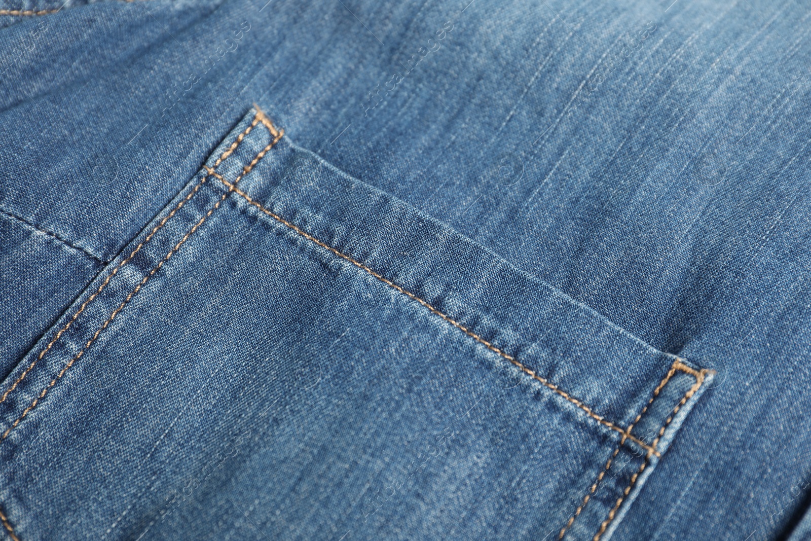 Photo of Stylish blue jeans with pocket as background, closeup