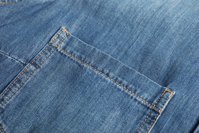 Photo of Stylish blue jeans with pocket as background, closeup