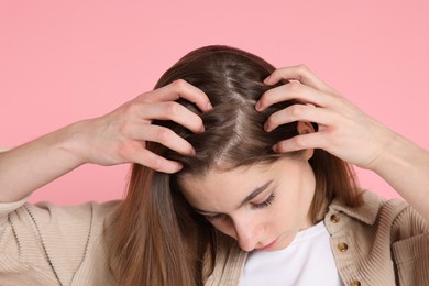 Girl with hair loss problem on pink background