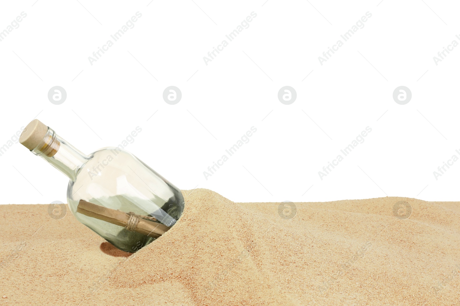 Photo of Rolled letter in corked glass bottle on sand against white background