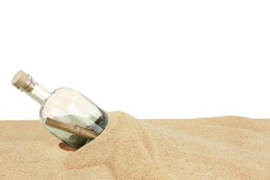 Photo of Rolled letter in corked glass bottle on sand against white background