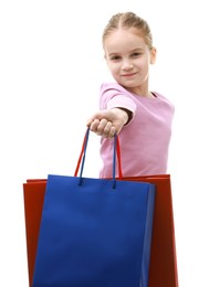 Photo of Cute little girl giving shopping bags on white background