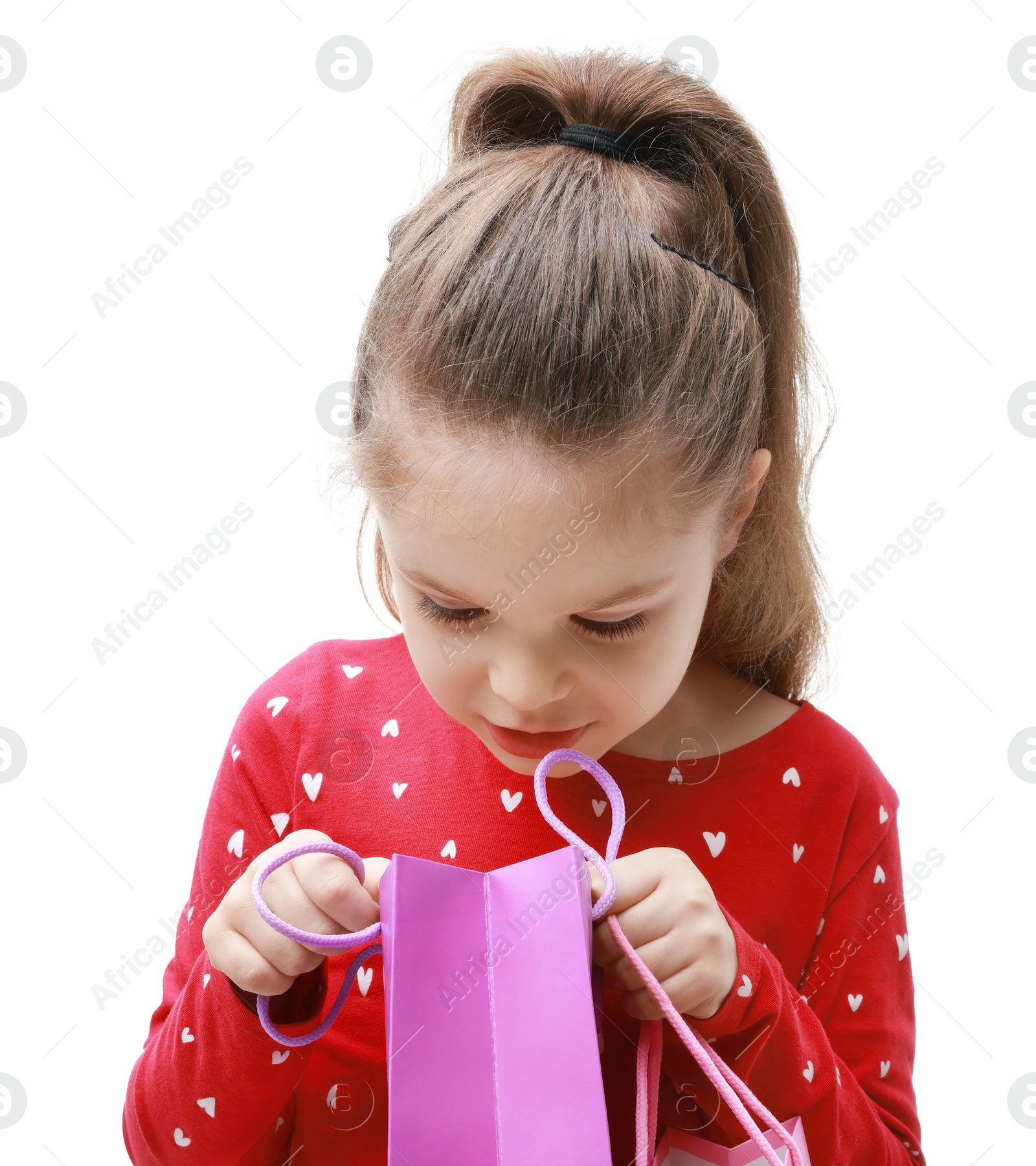 Photo of Cute little girl with shopping bag on white background