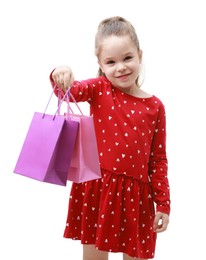 Cute little girl with shopping bags on white background