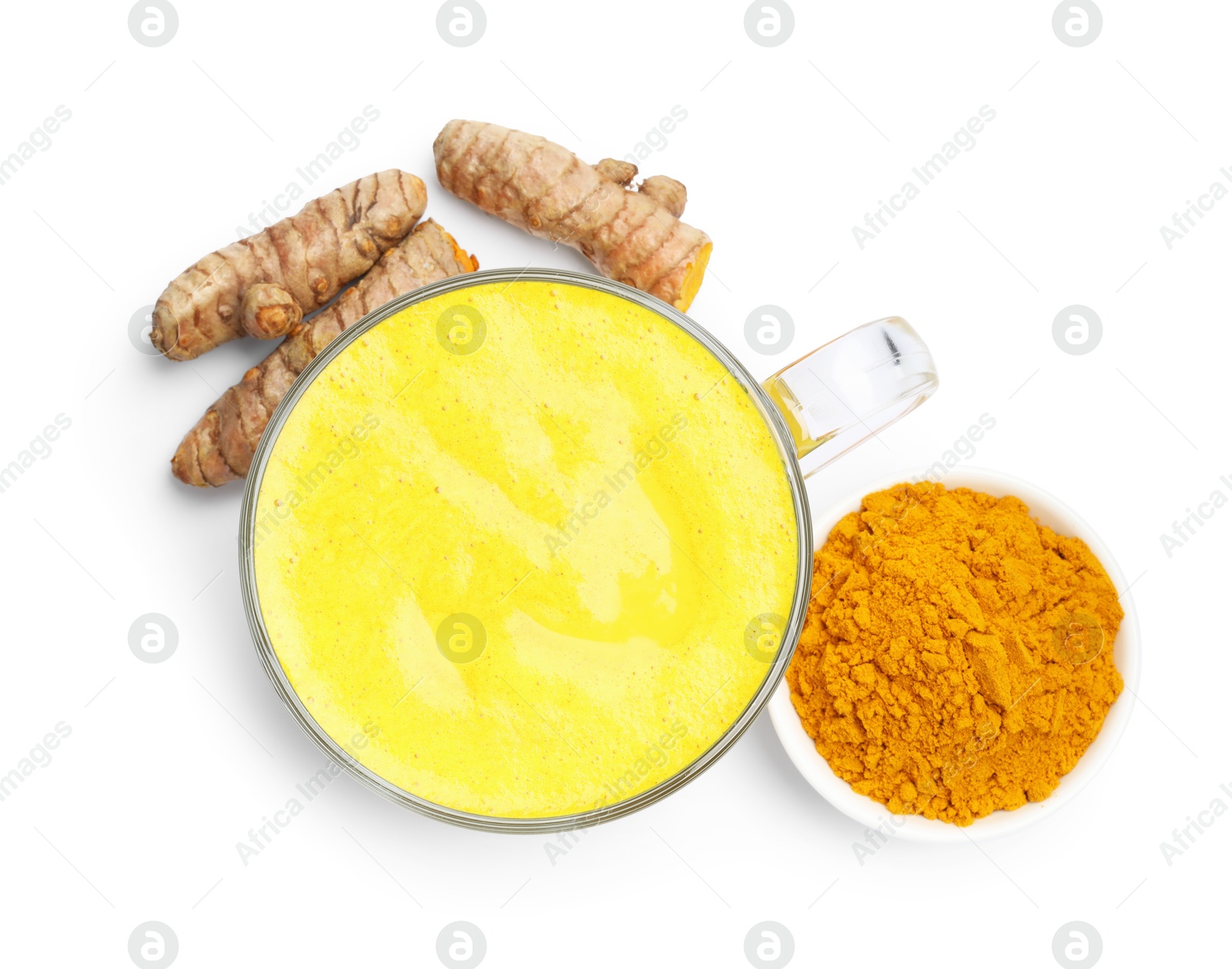 Photo of Tasty turmeric latte in cup, powder and roots isolated on white, top view