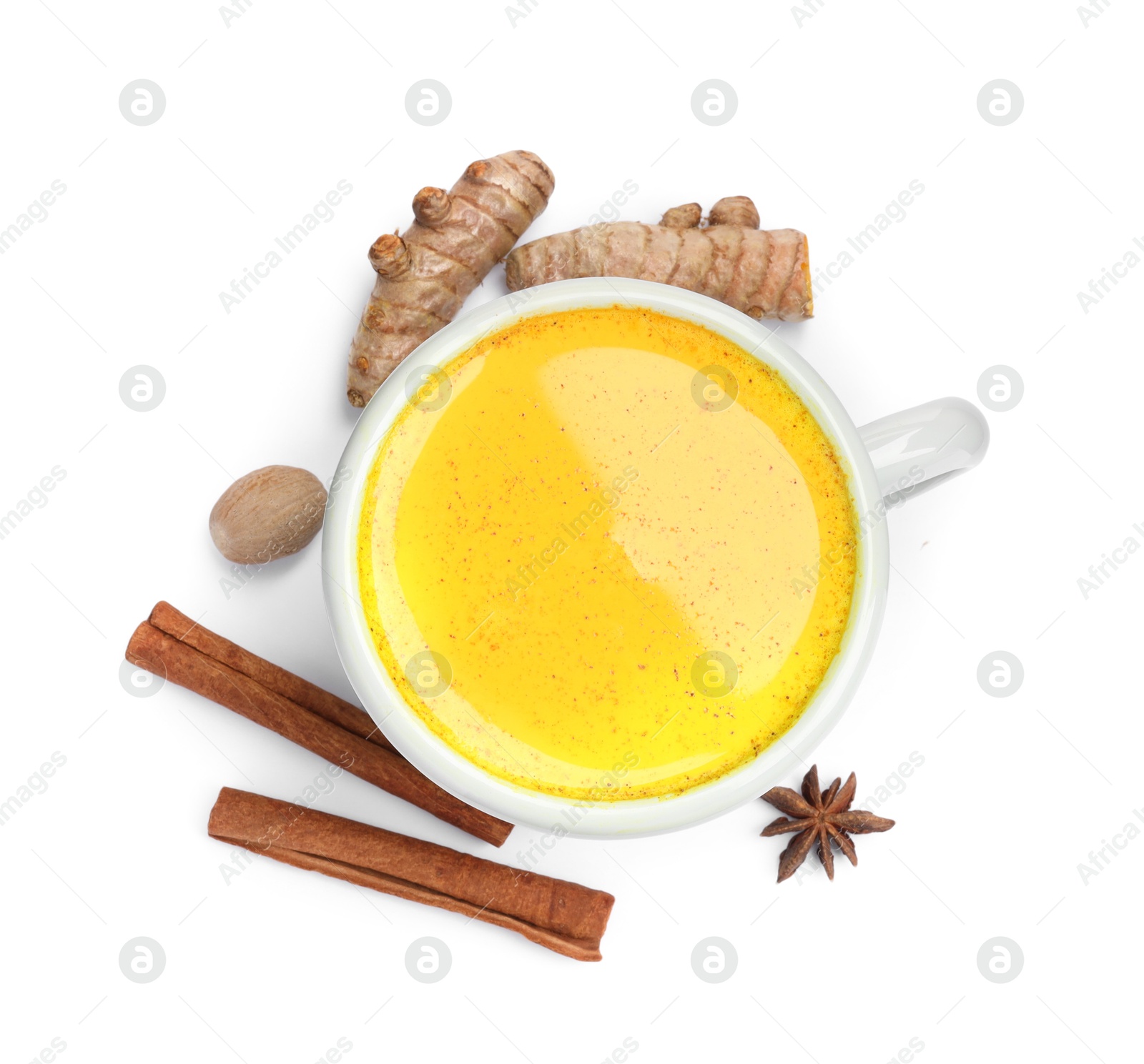 Photo of Tasty turmeric latte in cup and spices isolated on white, top view