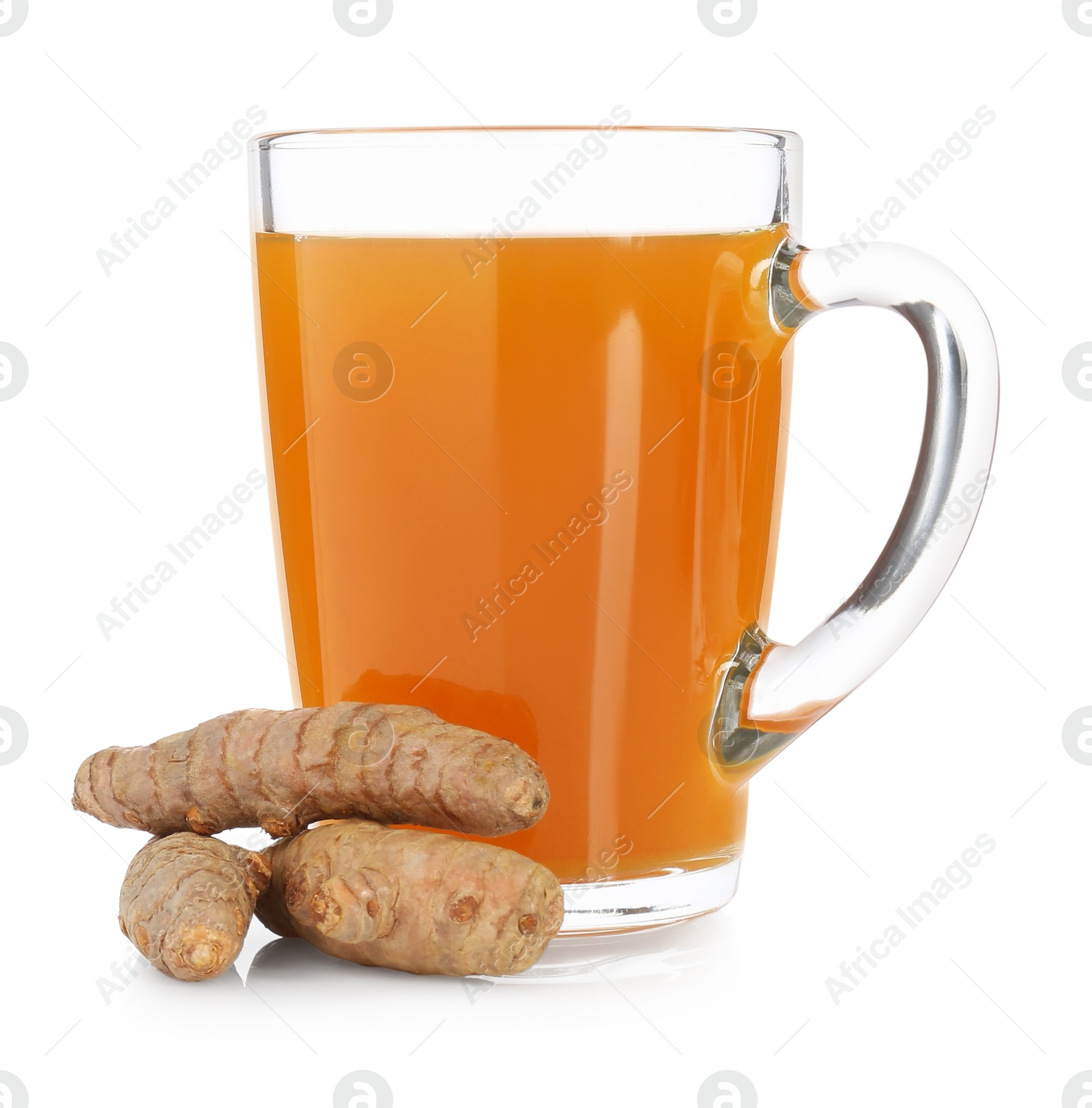 Photo of Aromatic turmeric tea in glass cup and roots isolated on white