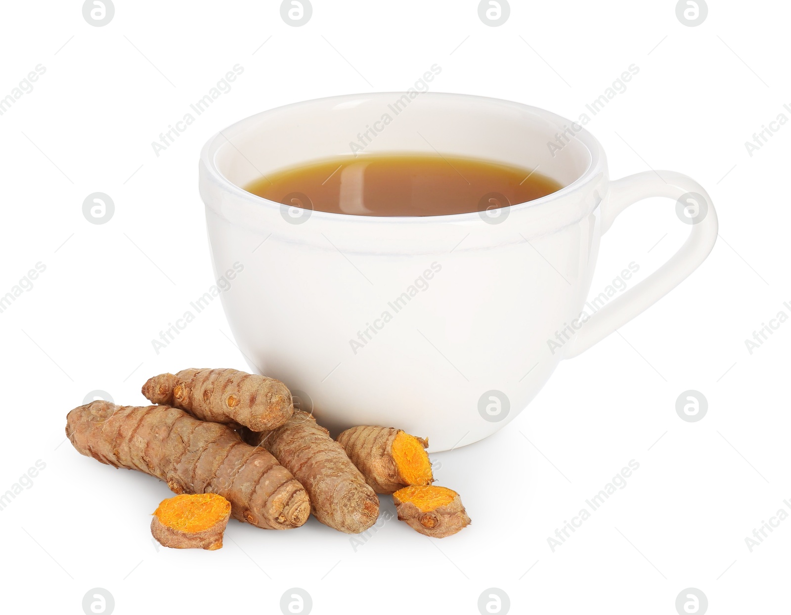 Photo of Aromatic turmeric tea in cup and roots isolated on white