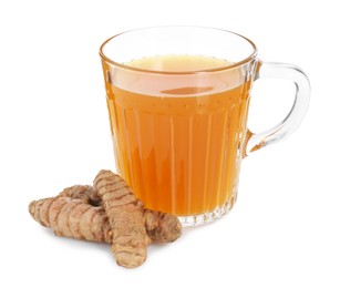 Photo of Aromatic turmeric tea in glass cup and roots isolated on white