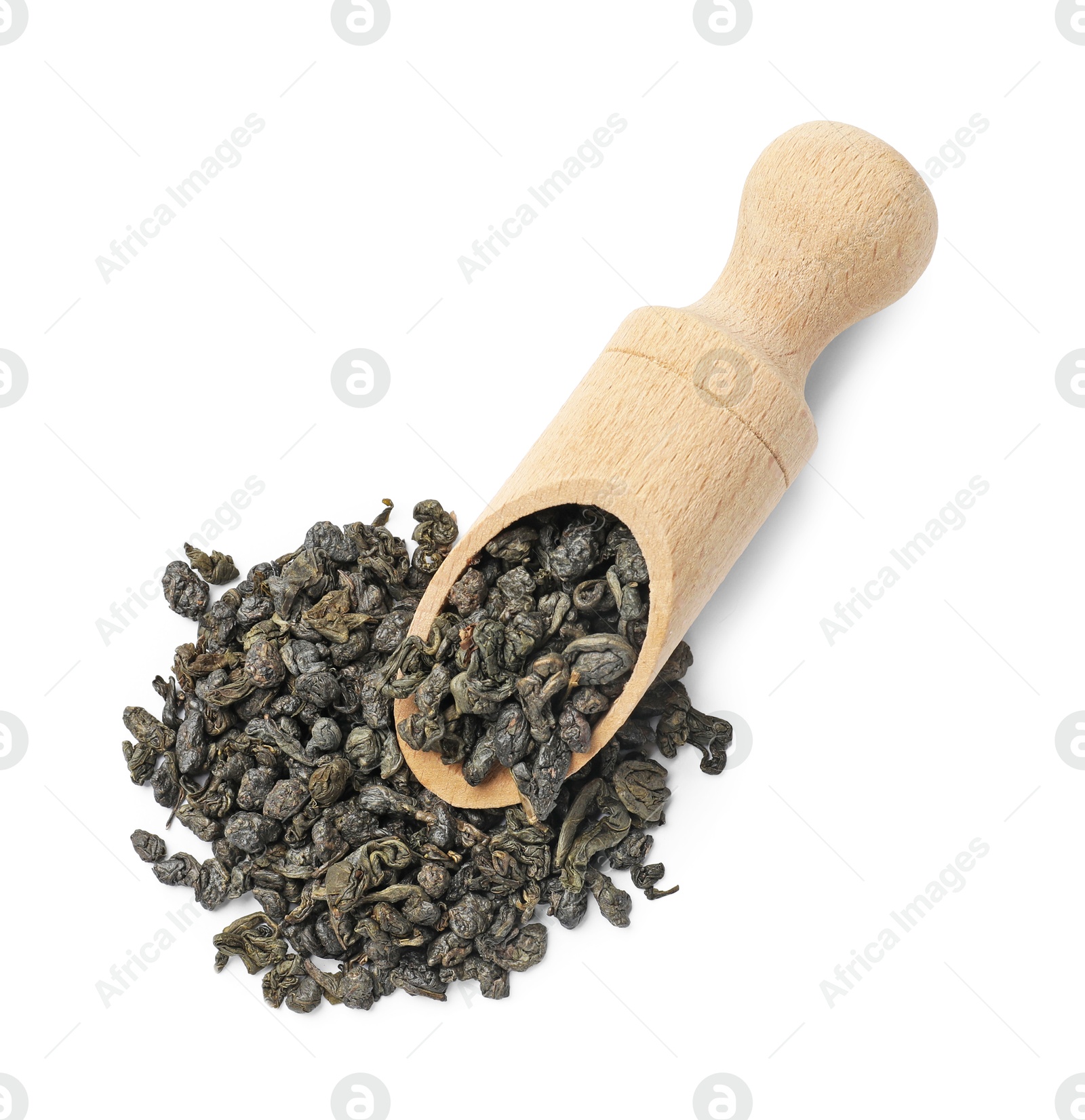 Photo of Dry tea leaves in wooden scoop isolated on white, top view