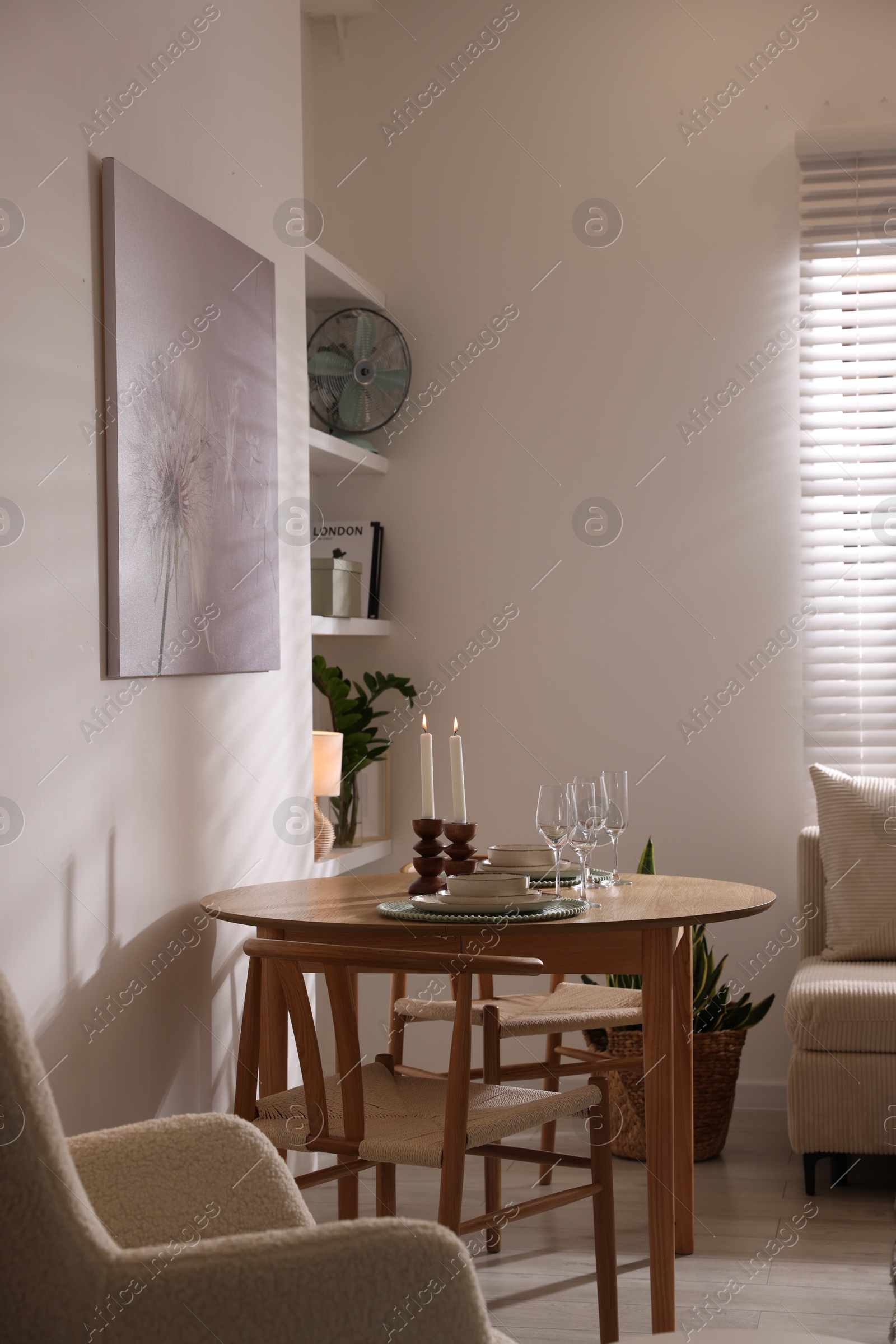 Photo of Stylish table setting and chairs in dining room. interior design