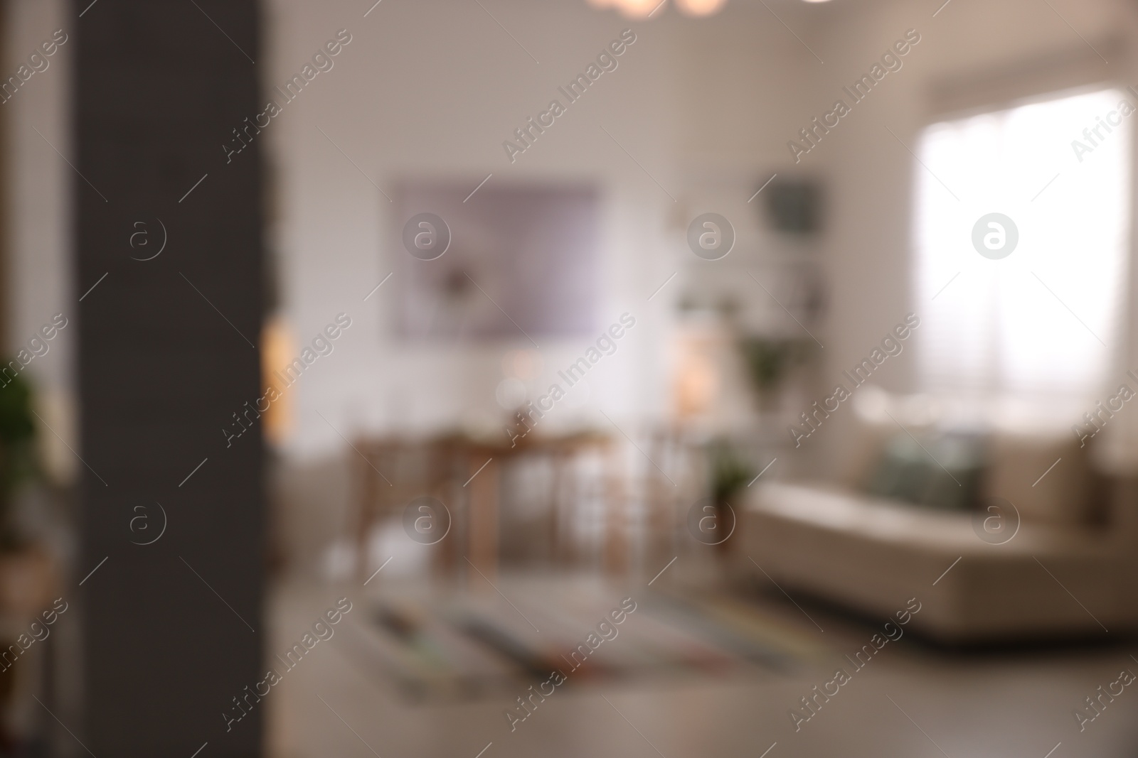 Photo of Blurred view of stylish dining room interior