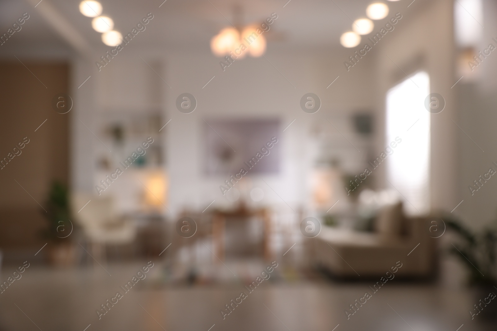 Photo of Blurred view of stylish dining room interior