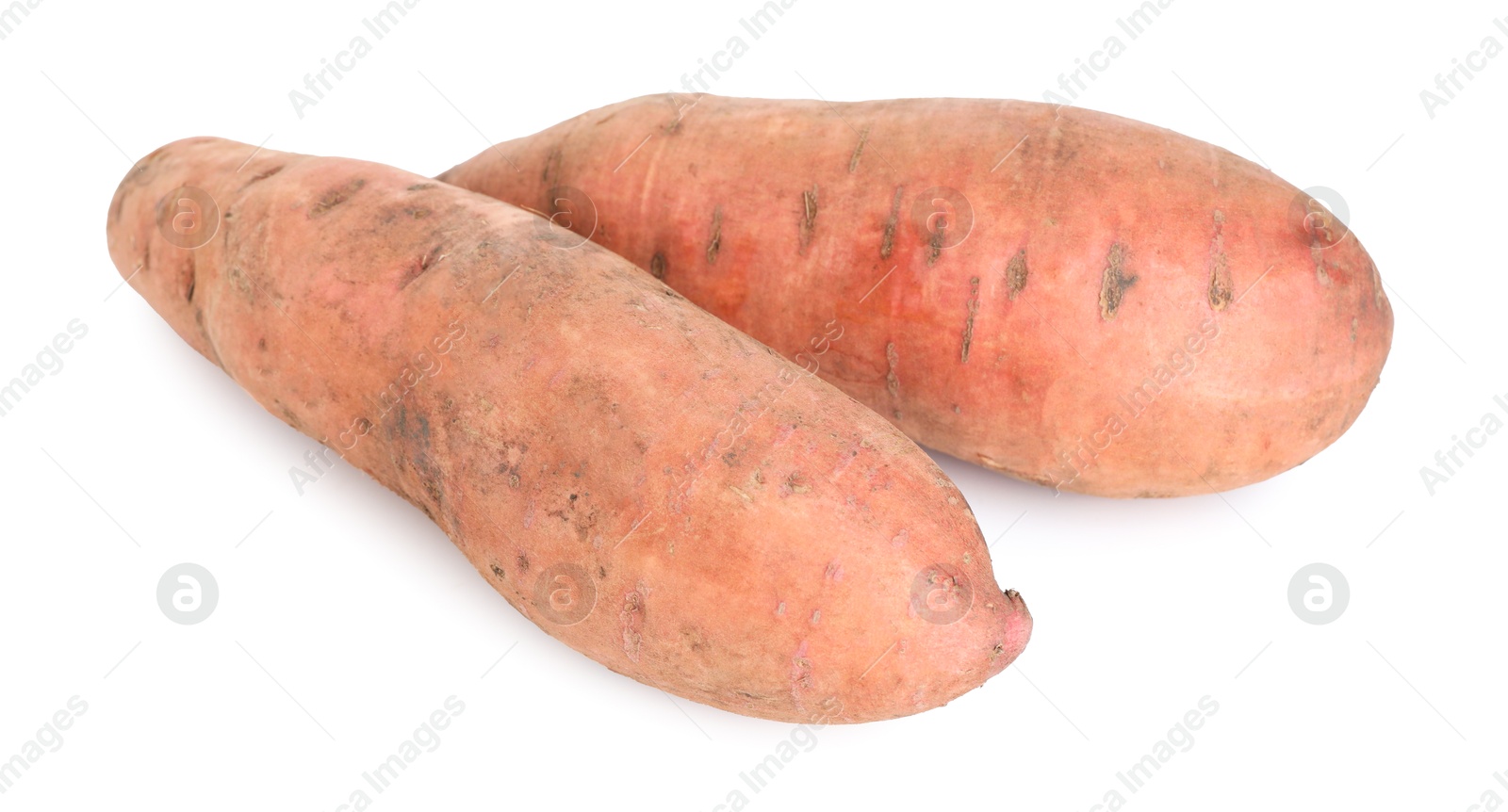 Photo of Fresh sweet potatoes isolated on white. Vegetable root