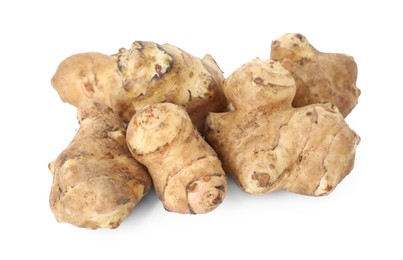 Photo of Fresh Jerusalem artichokes isolated on white. Root vegetable