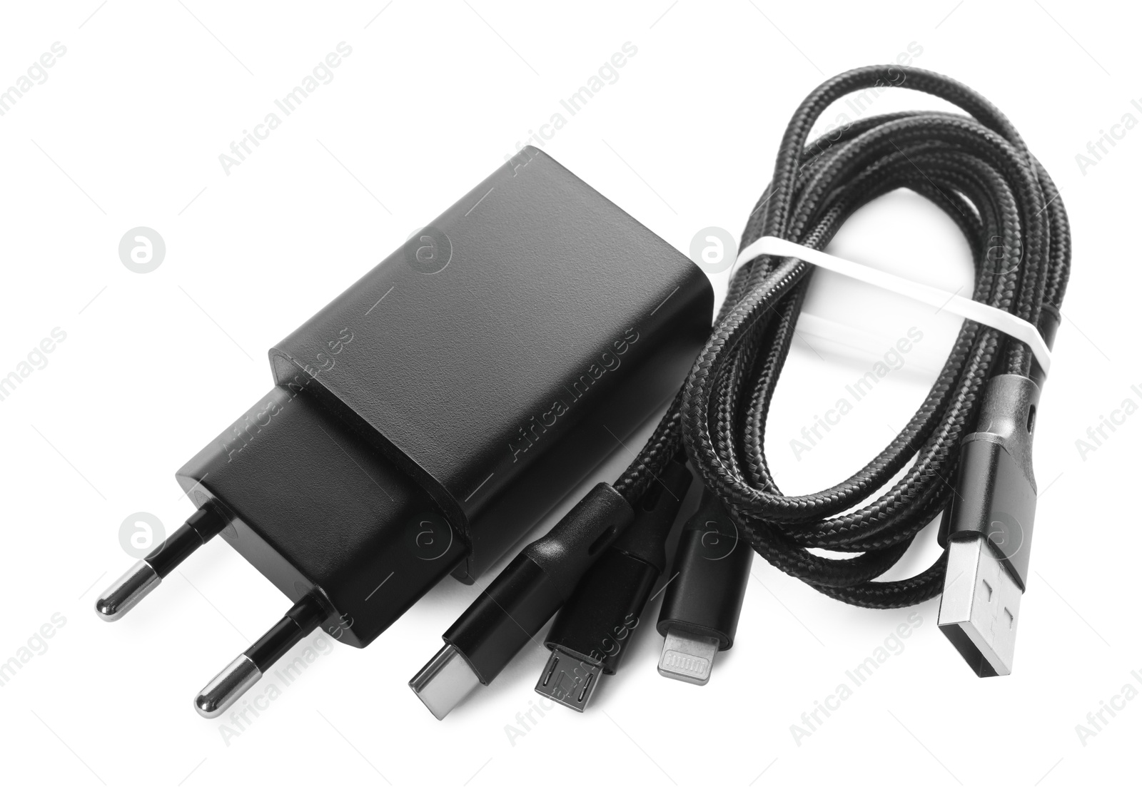 Photo of USB power adapter and triple charge cable isolated on white