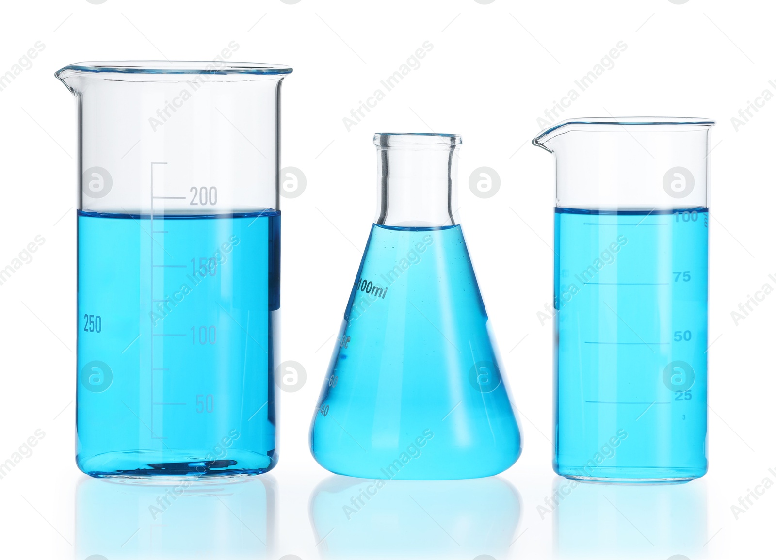 Photo of Laboratory glassware with blue liquid isolated on white