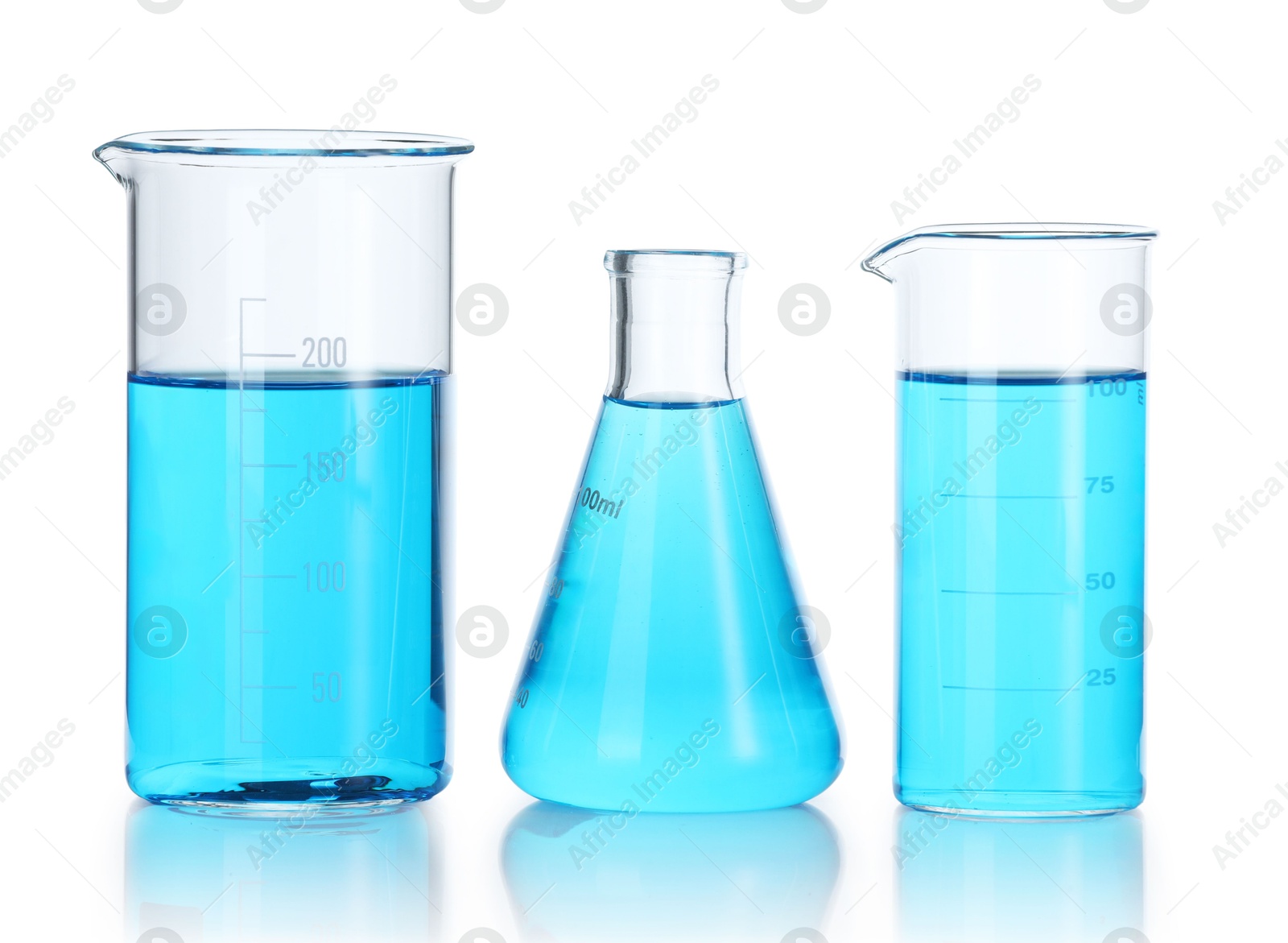 Photo of Laboratory glassware with blue liquid isolated on white