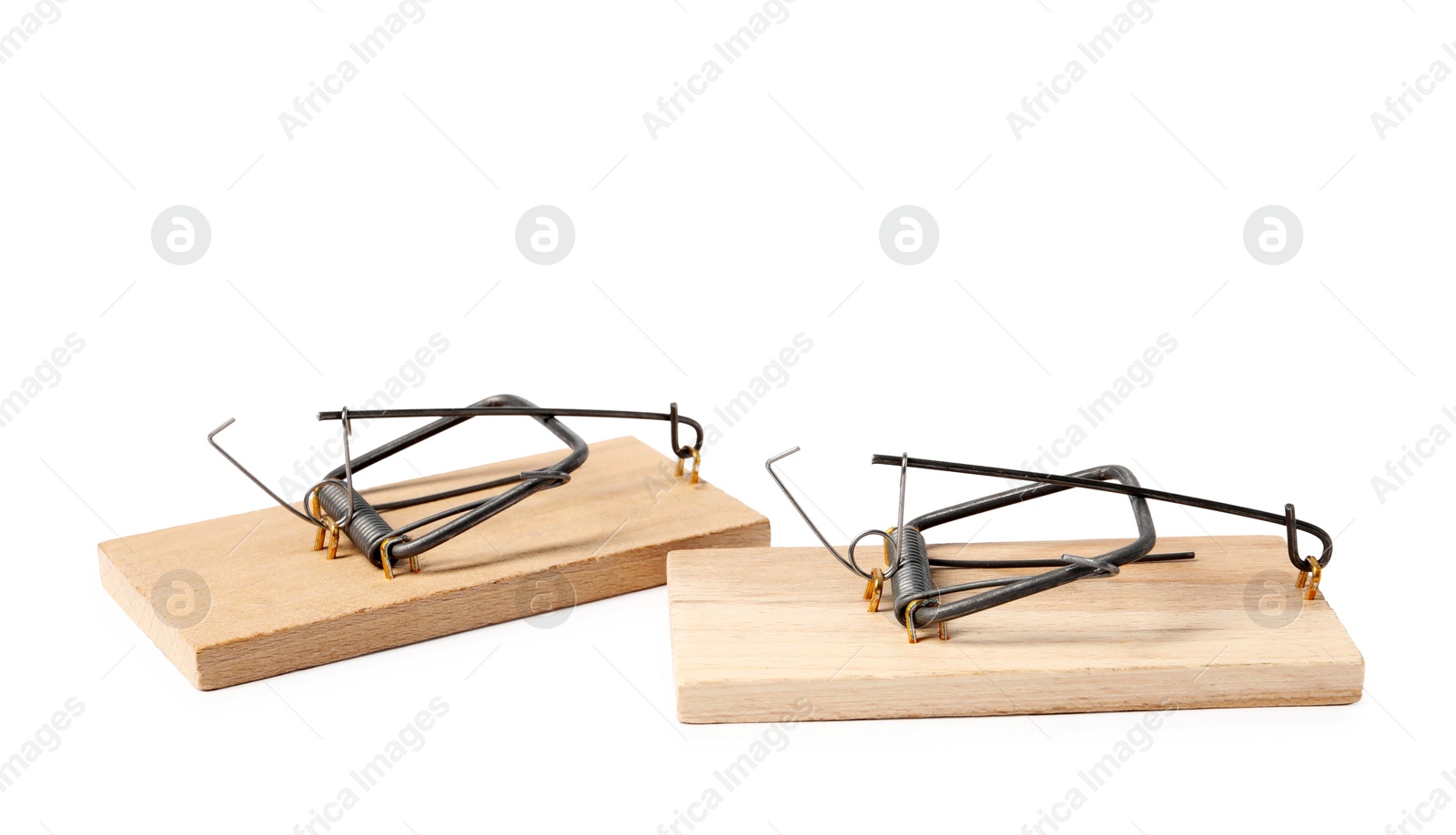 Photo of Two spring-loaded bar mousetraps isolated on white