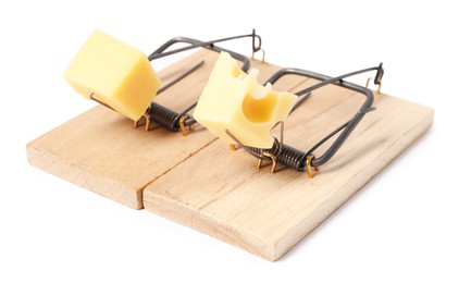 Photo of Two spring-loaded bar mousetraps with pieces of cheese isolated on white