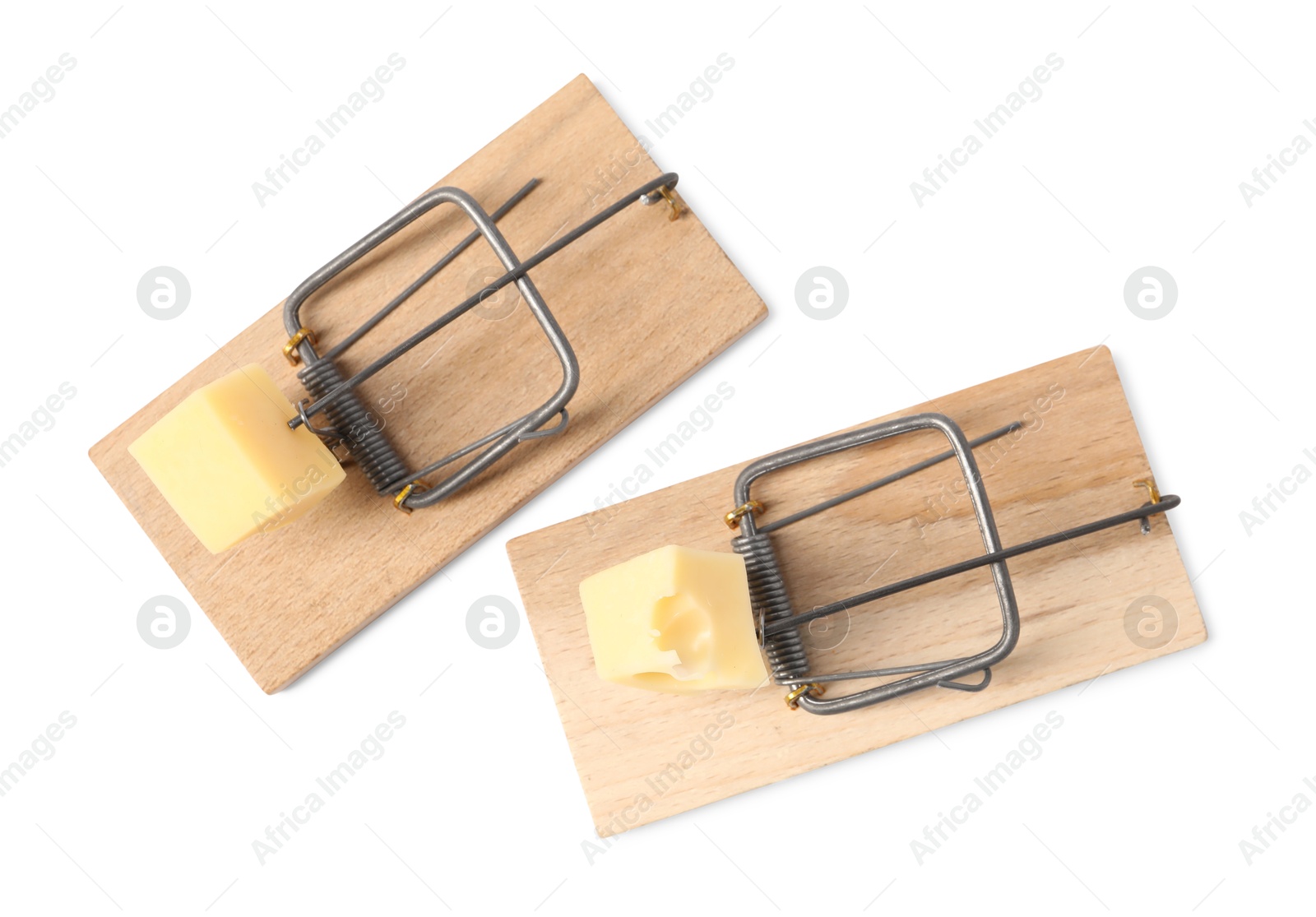 Photo of Two spring-loaded bar mousetraps with pieces of cheese isolated on white, top view