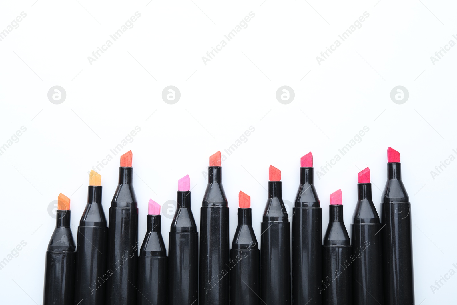 Photo of Many colorful markers on white background, top view