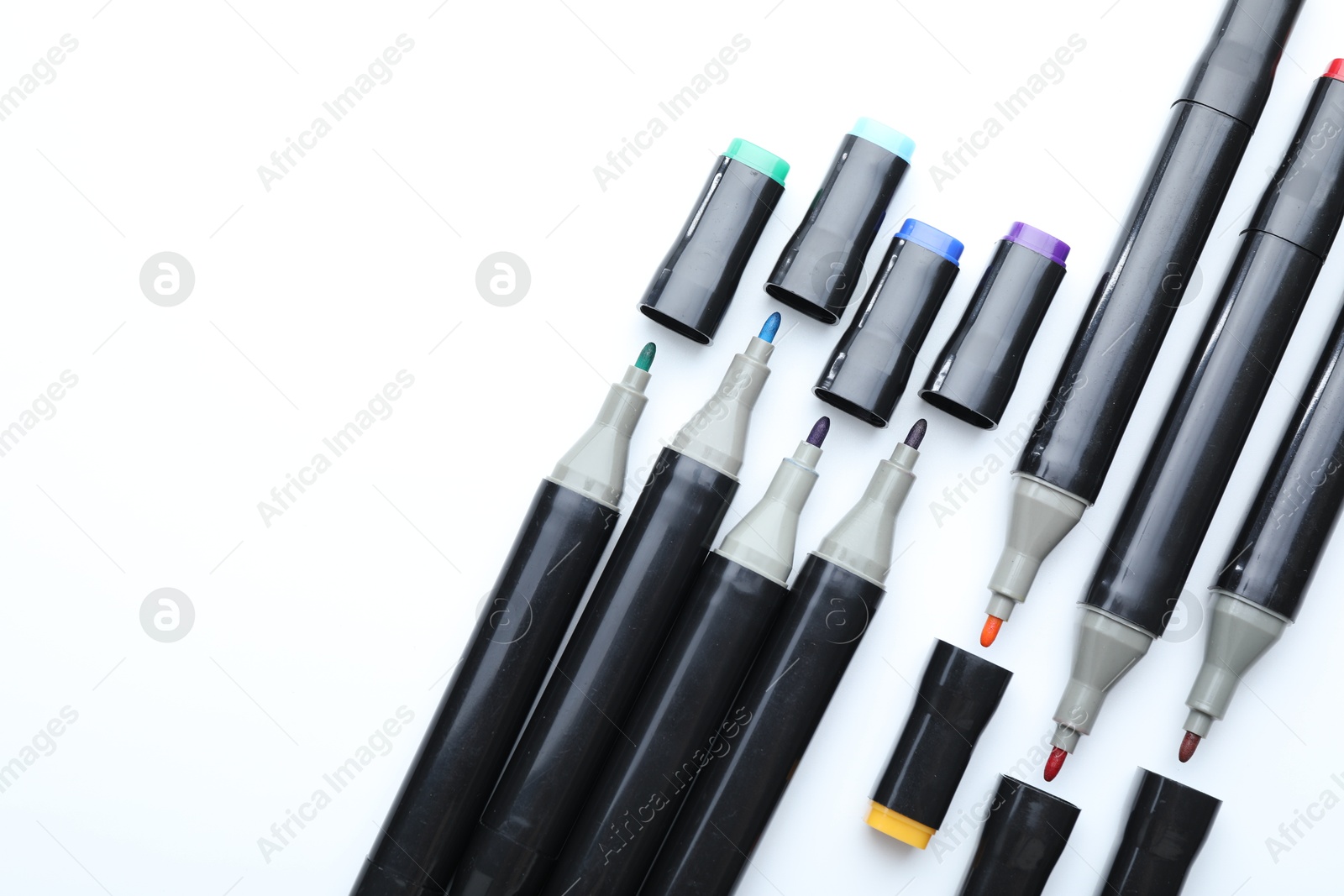 Photo of Many double sided markers on white background, top view