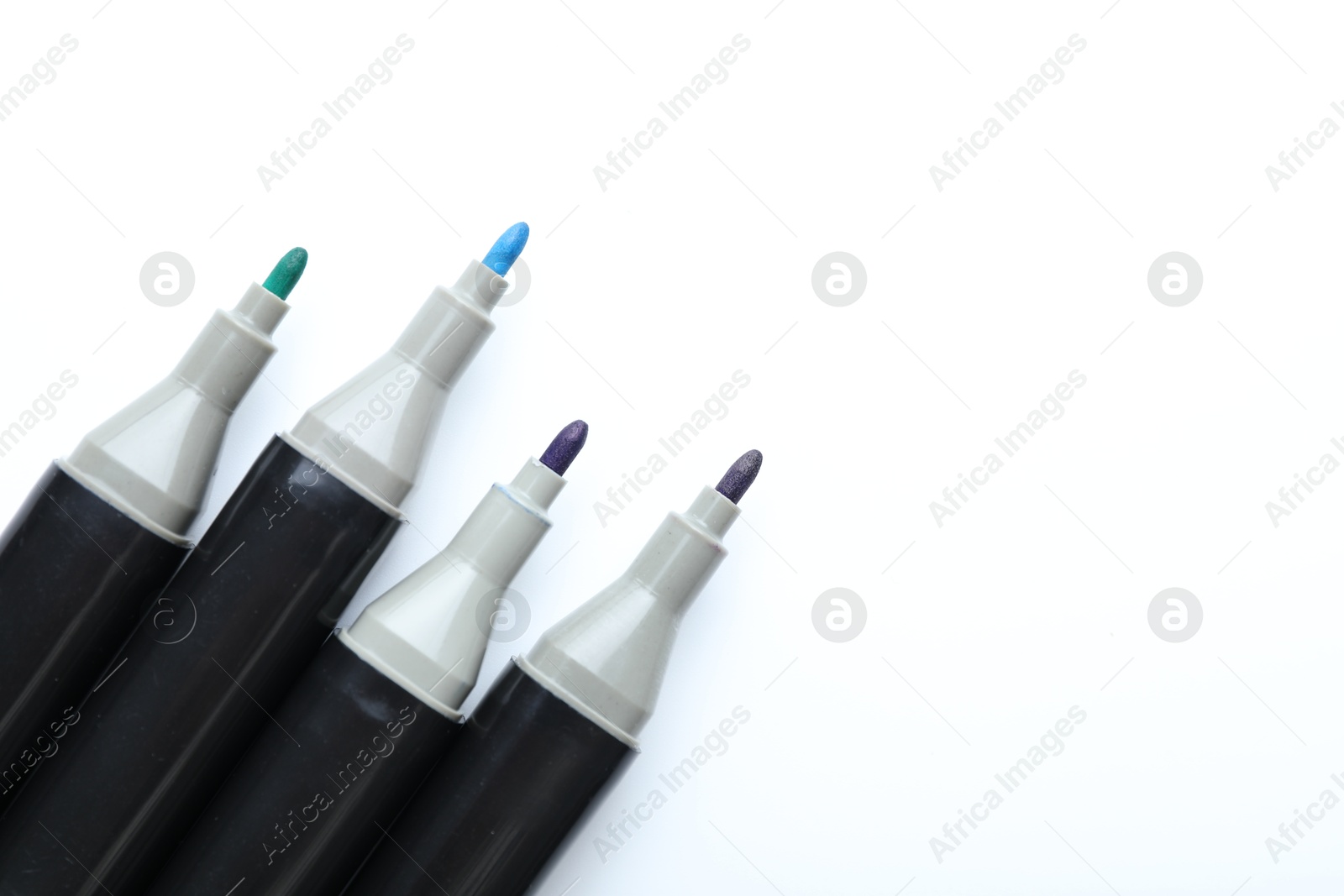 Photo of Many colorful markers on white background, top view