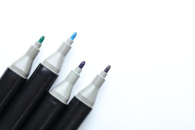 Photo of Many colorful markers on white background, top view