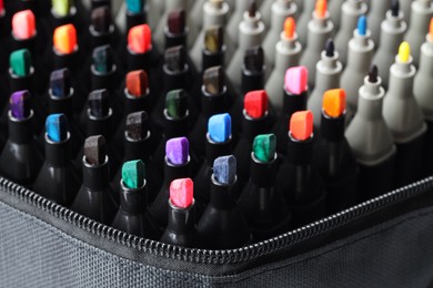 Photo of Many colorful markers in bag, closeup. Art supplies