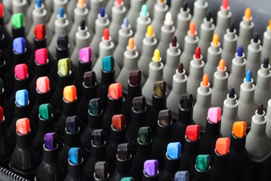 Photo of Many colorful markers in bag, closeup. Art supplies