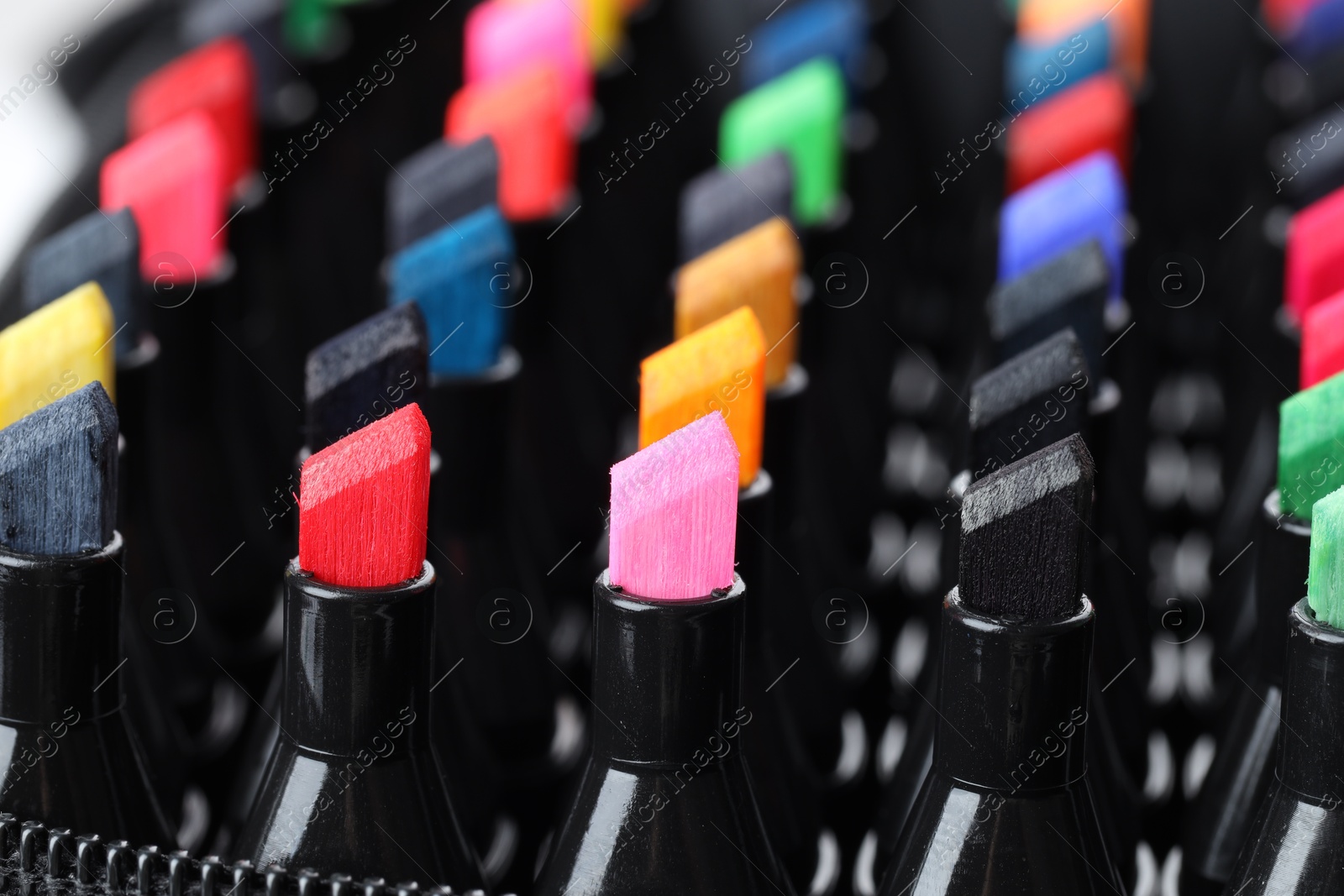 Photo of Many colorful markers in bag, closeup. Art supplies