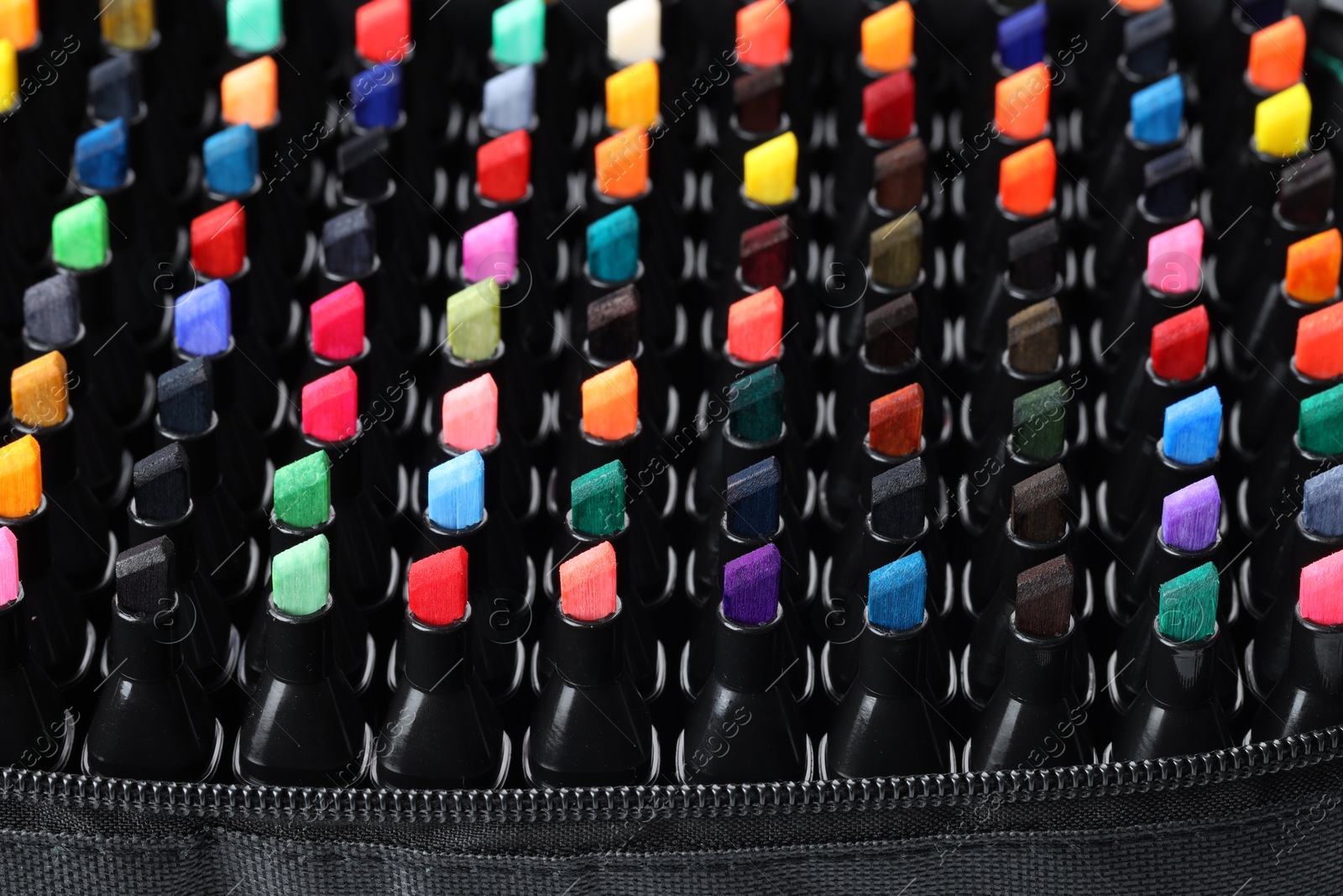 Photo of Many colorful markers in bag, closeup. Art supplies