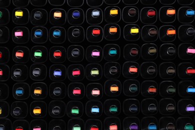 Photo of Many colorful markers as background, top view