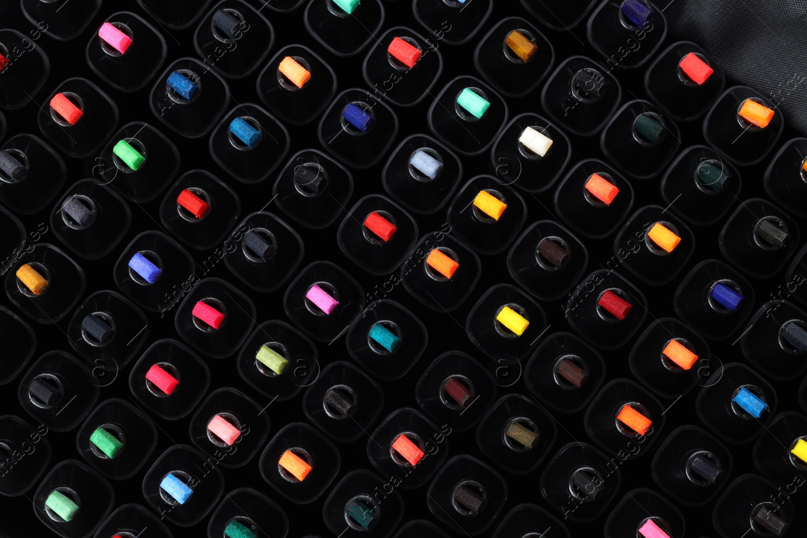 Photo of Many colorful markers as background, top view