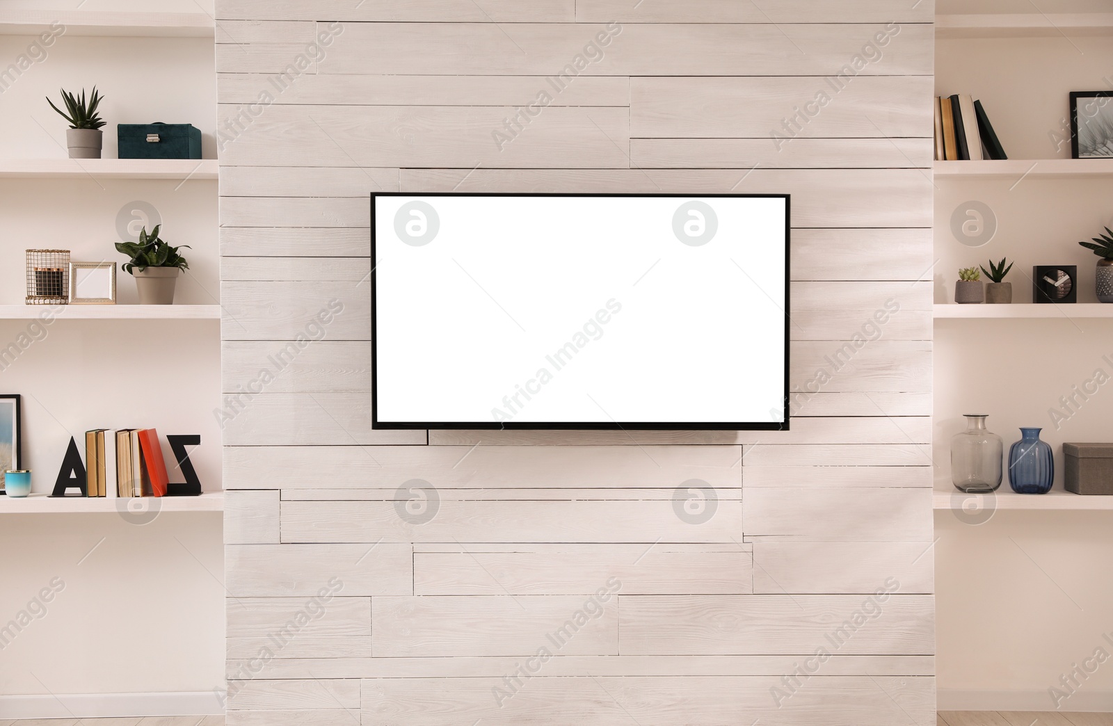 Image of Tv set with white screen mounted on wall in room. Mockup for design