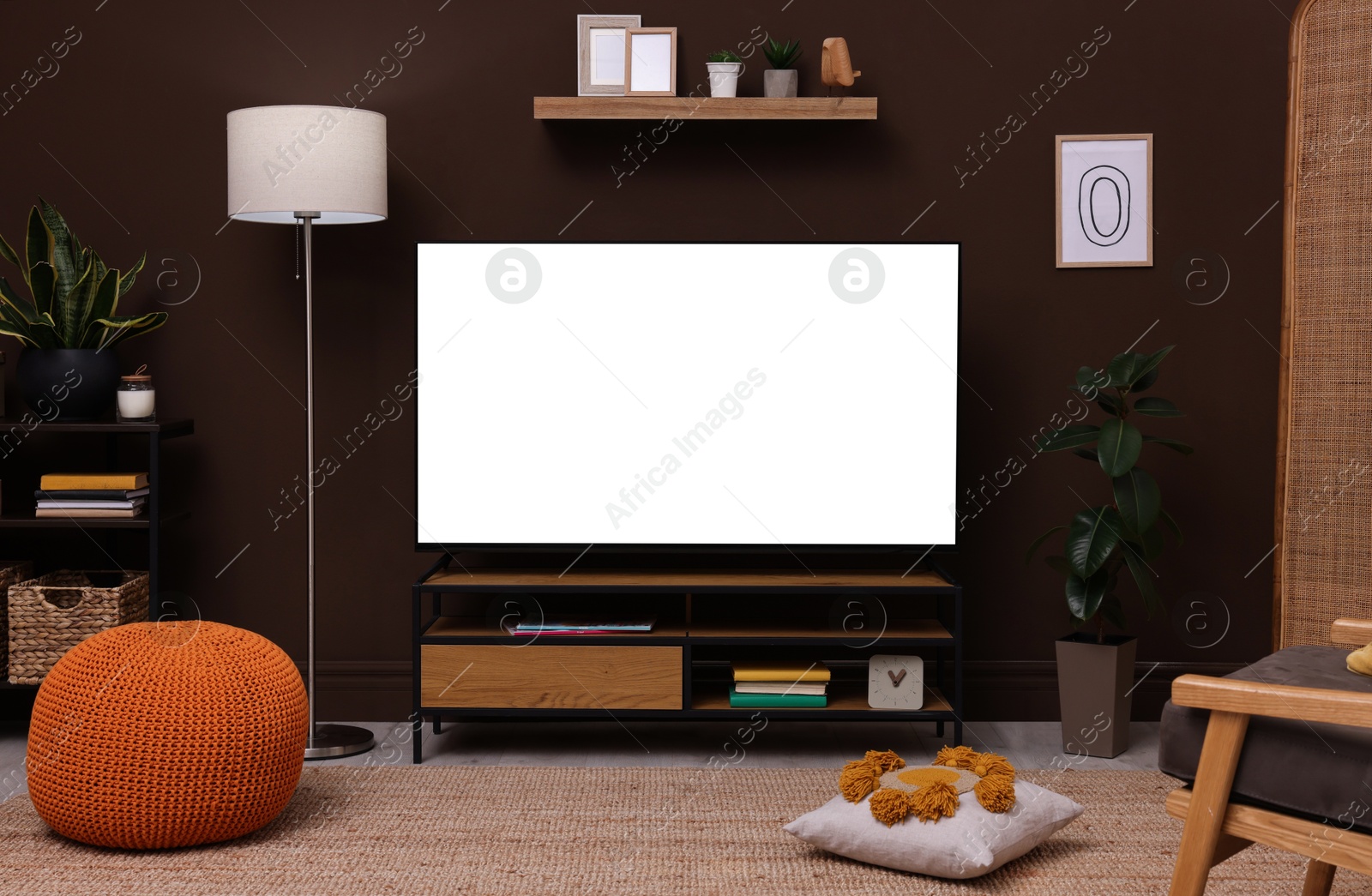 Image of Tv set with white screen on stand in room. Mockup for design