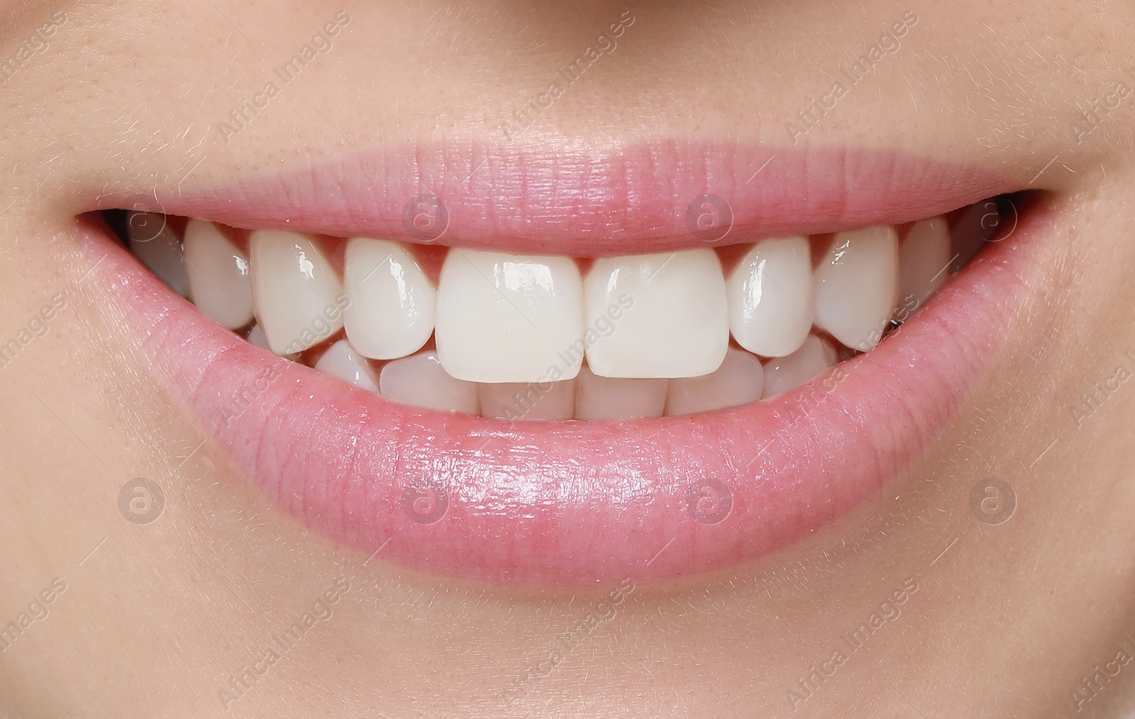 Image of Young woman with healthy teeth and beautiful smile, closeup