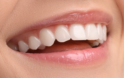 Image of Young woman with healthy teeth and beautiful smile, closeup