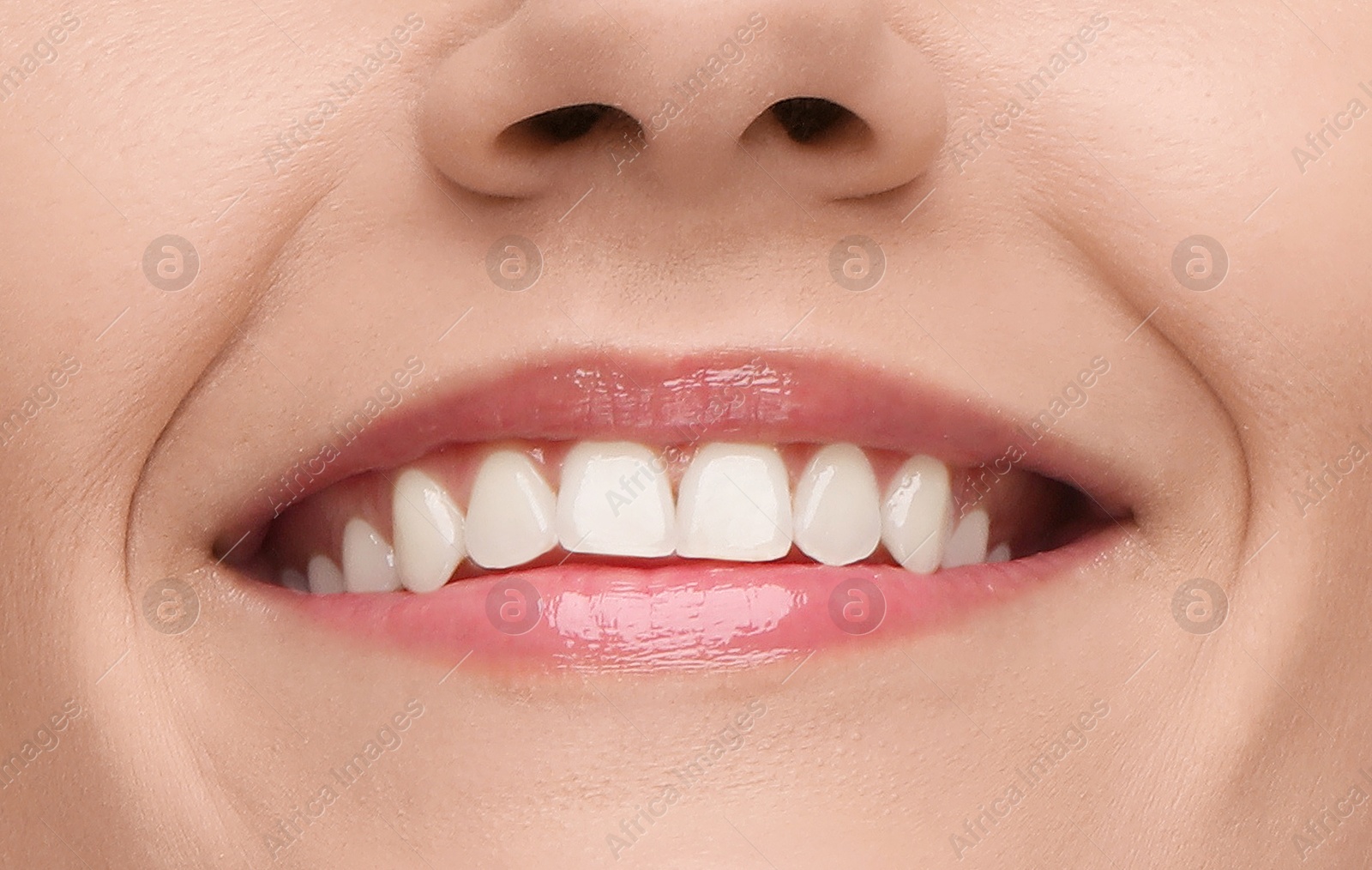 Image of Young woman with healthy teeth and beautiful smile, closeup