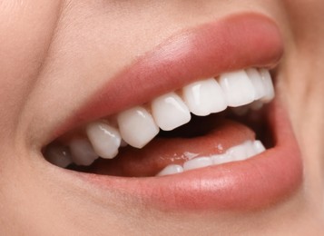 Image of Young woman with healthy teeth and beautiful smile, closeup