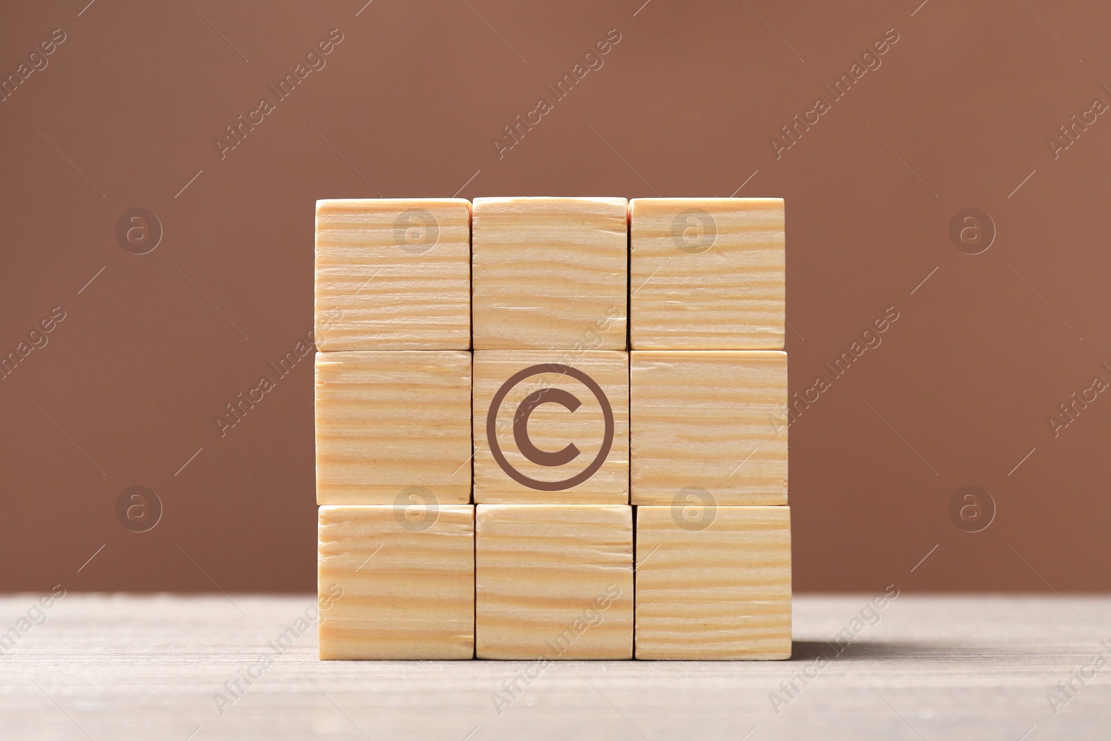 Image of License. One cube with copyright symbol among others on table