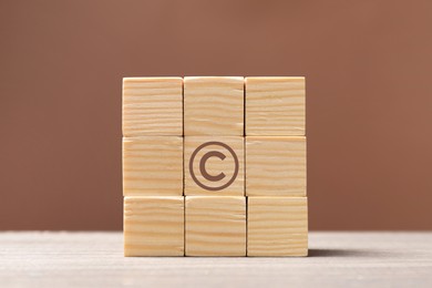 Image of License. One cube with copyright symbol among others on table