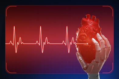 Image of Cardiology. Robot hand holding anatomical model of heart on gradient background. Red heartbeat line