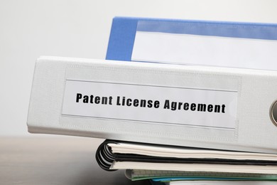 Image of File folder with Patent License Agreement label on table, closeup